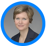 A picture of Anne Marie Sargent of Connor & Sargent inside a circle with a blue border outline.